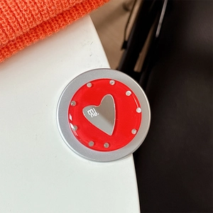 Detail of red heart phone grip with mine text and sparkling rhinestone embellishments