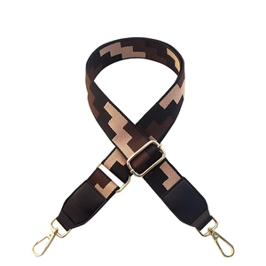 Adjustable brown geometric woven shoulder strap with black leather ends and gold hooks
