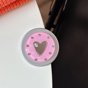 Close-up of pink round MagSafe phone grip with rhinestones and heart mirror detail