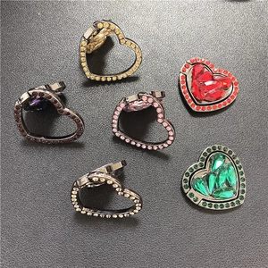 Detailed view of heart-shaped phone ring holders with rhinestones in five vibrant colors