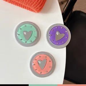 Three-piece heart-shaped MagSafe phone grips in mint, lilac, and coral with rhinestones