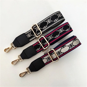 Close-up of adjustable striped canvas replacement straps with golden swivel hooks