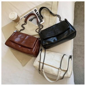 Chic quilted chain shoulder bag in coffee, black, and beige with vintage metal strap