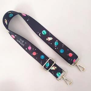 Adjustable wide shoulder strap featuring dream big space pattern and gold metal hooks