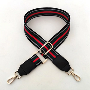 Adjustable wide fabric bag strap with classic red and green stripes and gold hardware