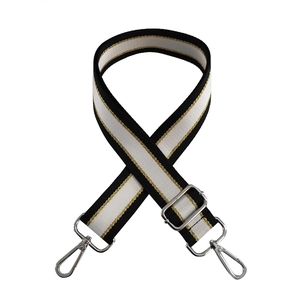 Adjustable wide black and white striped bag strap with gold thread and silver metal hooks