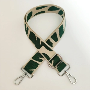 Adjustable wide replacement bag strap with green geometric pattern and silver hooks