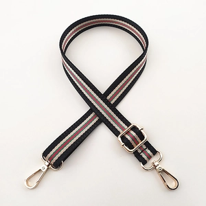 Adjustable woven purse strap with red and green stripes and gold metal hooks