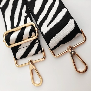 Adjustable zebra print replacement shoulder strap with gold-tone metal lobster clasps