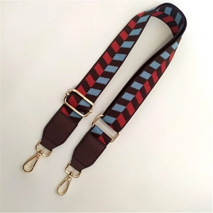 Adjustable wide replacement strap with red and blue jacquard pattern and leather ends