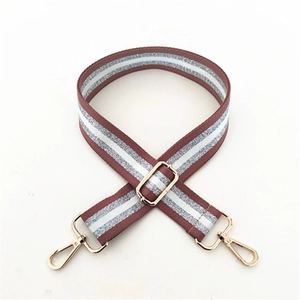Adjustable striped shoulder strap for bags with red and white patterns and gold hardware