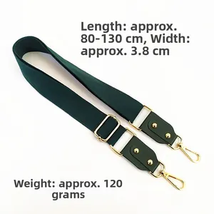 Detail of dark green adjustable cotton strap with gold lobster clasps and leather ends