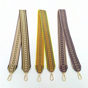Detailed view of bohemian style woven bag straps with high quality golden lobster clasps