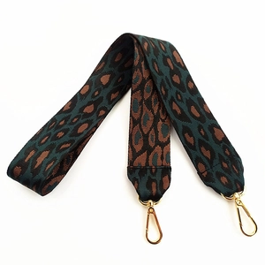 Wide leopard print bag strap with green and brown patterns and golden lobster clasps
