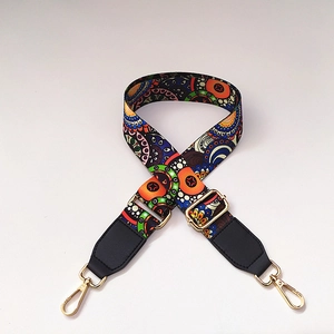 Close-up of adjustable ethnic mandala pattern nylon strap with gold metal hooks