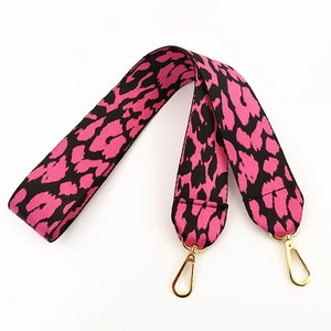 Detailed view of pink leopard print wide shoulder strap with gold lobster clasps