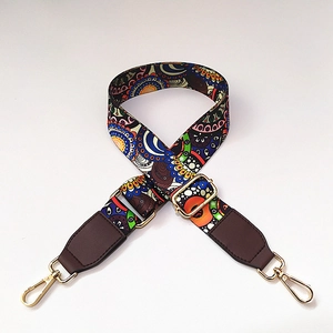 Detail of adjustable bohemian colorful wide shoulder strap with golden metal hardware