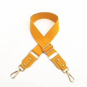 Adjustable mustard yellow woven cotton shoulder strap with gold metal lobster clasps