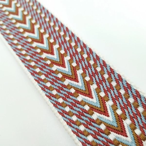 Close-up of bohemian geometric jacquard weave strap with thick high-density embroidery