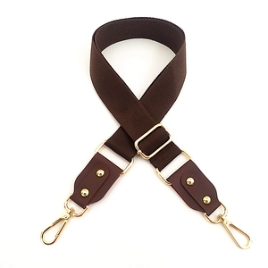 Adjustable wide canvas shoulder strap with brown leather and gold metal hooks