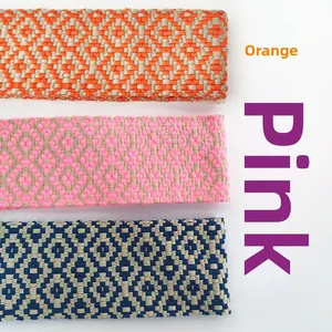 Detail of woven jacquard straps with geometric diamond patterns in orange pink and blue