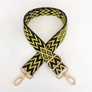 Adjustable wide replacement bag strap with black and yellow geometric woven patterns