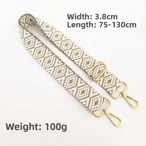 Detail of adjustable 3.8cm wide jacquard strap with geometric pattern and gold swivel hooks