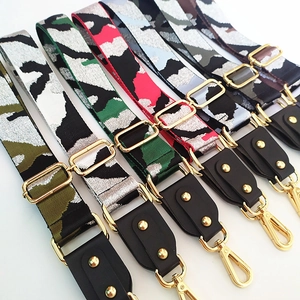 Adjustable wide camouflage shoulder straps with premium gold hardware and leather ends