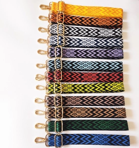 Detail view of 12 colorful jacquard replacement straps with gold metal hooks and buckles