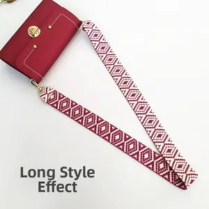 Detail of red leather crossbody bag with ethnic geometric pattern wide strap and gold lock