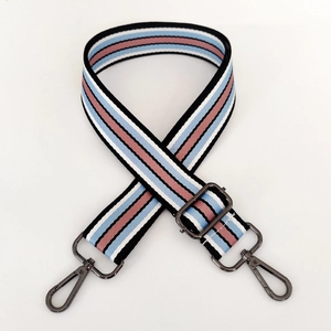 Detail of adjustable colorful striped strap with gunmetal swivel hooks for cross-body bags