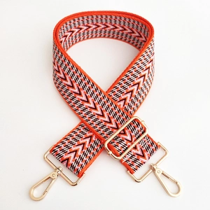 Adjustable wide replacement bag strap with orange ethnic geometric woven pattern