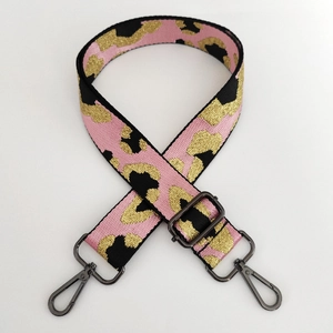Adjustable leopard print nylon strap with metallic pink and black woven texture