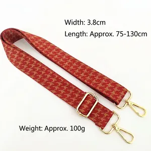 Adjustable wide replacement bag strap with red houndstooth pattern and gold buckles