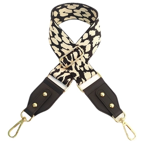 Adjustable leopard print wide shoulder strap with leather ends and gold metal buckles
