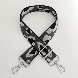 Detail of adjustable leopard print bag strap with silver metal swivel lobster clasps