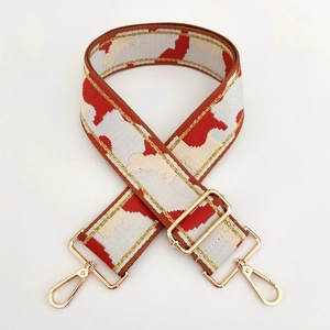 Adjustable wide camouflage woven strap with gold thread details and light gold metal hooks