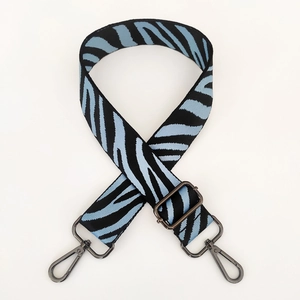 Detail of adjustable blue and black zebra pattern strap with gunmetal lobster clasps