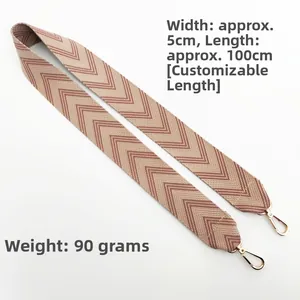 Detail view of 5cm wide thick herringbone pattern jacquard strap with gold metal hooks
