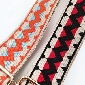 Detail of adjustable colorful woven jacquard bag straps with gold metal hardware buckle