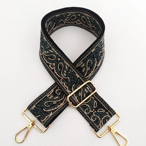 Close-up of ethnic paisley jacquard strap with gold-tone zinc alloy swivel hooks
