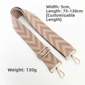 Close-up of 5cm wide beige and pink wavy woven bag strap with adjustable gold buckle
