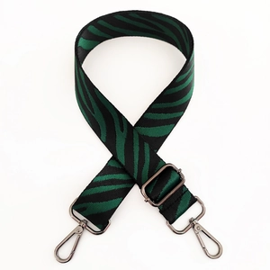 Close-up of zebra pattern wide replacement strap with metal swivel hooks and slider
