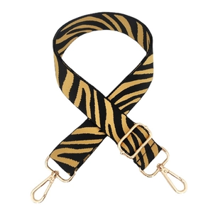 Adjustable wide replacement bag strap with black and yellow zebra pattern and gold hooks