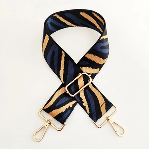 Adjustable wide zebra stripe bag strap with light gold metal swivel hooks for handbags