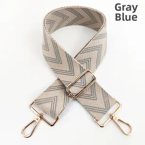 Grey blue woven wide shoulder strap with chevron pattern and gold swivel snap hooks