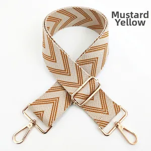 Ginger yellow woven canvas bag strap with gold metal lobster hooks and adjustable buckle