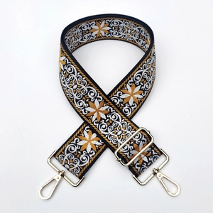Wide bohemian embroidered bag strap with floral patterns and golden swivel hooks