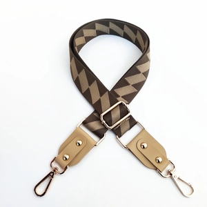 Adjustable wide replacement bag strap with brown and khaki chevron pattern on white background