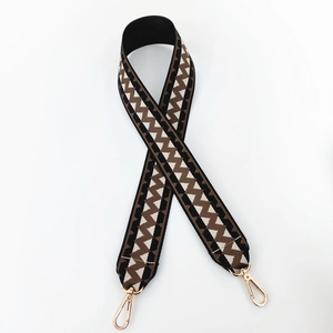 Detail of bohemian zigzag woven wide shoulder strap with gold metal lobster clasps